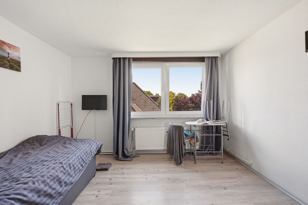 Schlafzimmer des Mehrfamilienhauses in Brokdorf, Aufnahme 1.