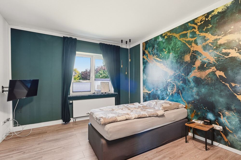 Schlafzimmer des Mehrfamilienhauses in Brokdorf, Aufnahme 3.
